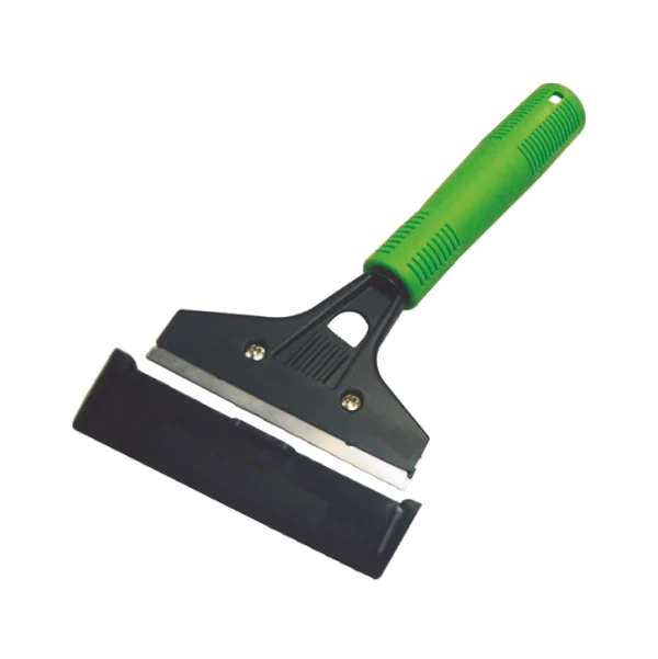 Espátula tipo cuchilla para pisos con mango ergonómico verde, base negra y cuchilla metálica afilada, diseñada para remover suciedad y residuos adheridos en superficies difíciles.