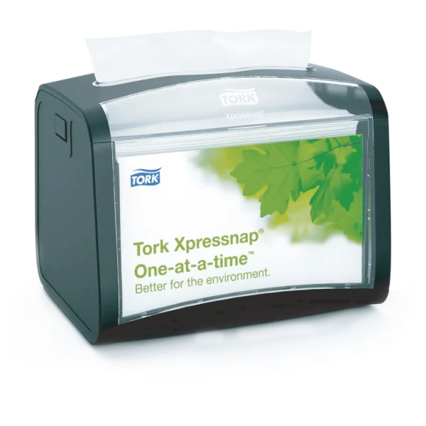 Despachador Tork Xpressnap Advanced. Servilletero de sobremesa con capacidad para 275 servilletas N4, diseño moderno con base oscura y tapa transparente, sistema de dispensado una a una para higiene y ahorro.