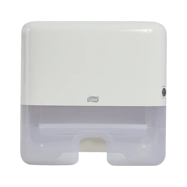 Dispensador Tork de toallas interdobladas mini, de plástico color blanco y gris translúcido. Con diseño compacto y funcional para espacios reducidos, asegura dispensación individual, higiene y comodidad.